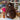 Brown Inkari Stuffed Alpaca in a yarn shop setting. Adorable and soft, part of the Natural series. Focus keyword: Stuffed Alpaca.