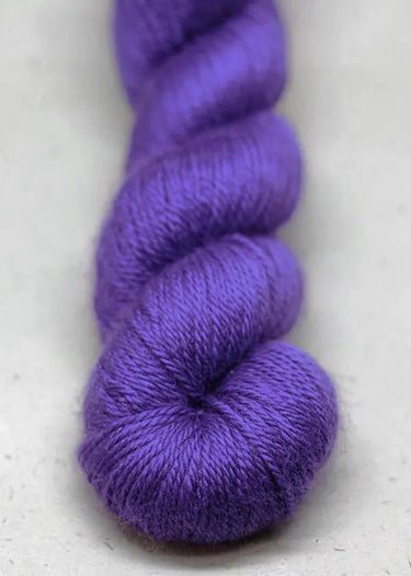 John Arbon | Knit By Numbers | British Yarn, Colour: Purple 25, This base has lustre and drape, but still packed with crisp stitch definition and soft enough to wear next to the skin. With an innovative colour palette providing the precise shade. Each col