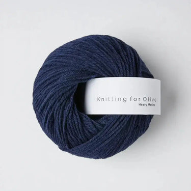 Knitting for Olive Heavy Merino yarn in dark blue, 100% Merino wool from ethical New Zealand sheep. Soft and natural fiber texture.