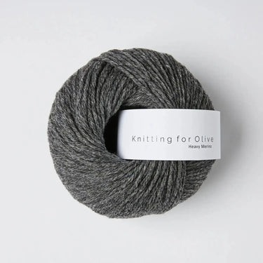 Knitting for Olive Heavy Merino yarn in dark grey color, showcasing its 100% natural merino wool texture and quality.