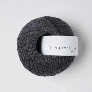 Knitting For Olive Merino yarn in dark grey, perfect for crafting breathable and cozy garments.