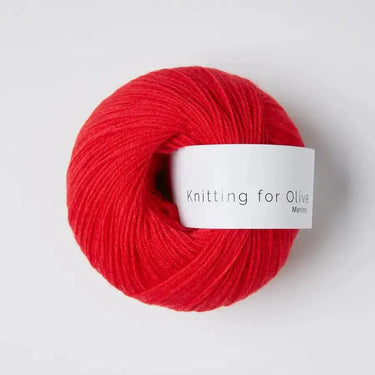 Knitting For Olive Merino yarn in bright red for winter hikes and camping comfort.