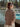 Woman by the Baltic Sea wearing knit from Laine Magazine Spring Issue 28