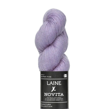 Lavender skein of yarn with Laine Novita label on a white background