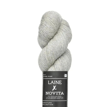 Gray skein of yarn with Laine Novita label on a white background