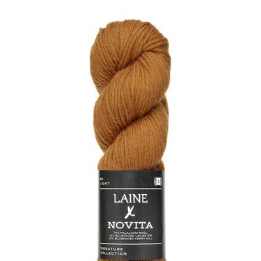 Skein of Laine x Novita DK yarn in brown, featuring high-quality British fibres ideal for knitting projects.