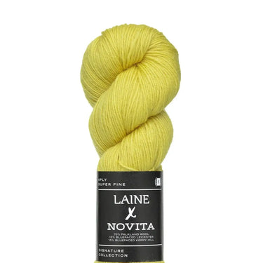 Yellow skein of yarn with Laine Novita label on a white background