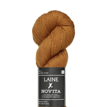 Brown skein of yarn with 'Laine Novita' label on a white background