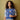Woman wearing blue and white crochet cardigan featured in Let's Crochet Issue 2 by Laine