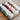 Løvetand by CaMaRose organic linen yarn in various colors, ideal for summer knitwear and crochet projects like tops and beach bags.