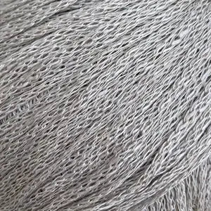 Close-up of Løvetand by CaMaRose, a chainette yarn made of 100% organic linen fibers, ideal for summer knitwear and crochet projects.