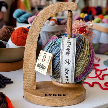 Lykke Wooden Yarn Holder | Magnetic Rotating Yarn Stand, Colour: Mango, Discover Lykke’s handcrafted wooden yarn holder with magnetic rotating spool — beautiful, practical, and sustainable. Perfect for knitting and crochet projects, Knit With Me