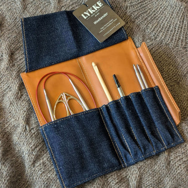Knitting Needle Travel Case - LYKKE Weekender with denim and vegan leather, open to display knitting tools neatly organized inside.
