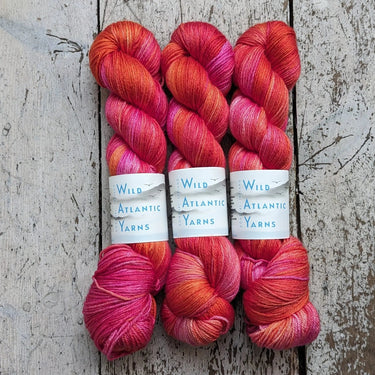 Wild Atlantic | Niamh | Merino & Silk Yarn, Colour: Firerose, A luxurious blend of silk and merino combined to produce this beautifully soft base. Niamh means lustre, radiance and brightness which is this sumptuous yarn. With wonderful stitch definition a