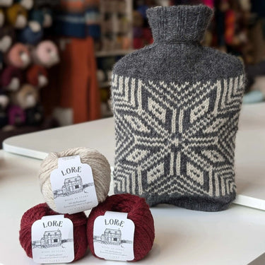 Pochie Hot Water Bottle - Knitting Kit with yarn and patterned cover, perfect for cozy winter crafting and gifts.