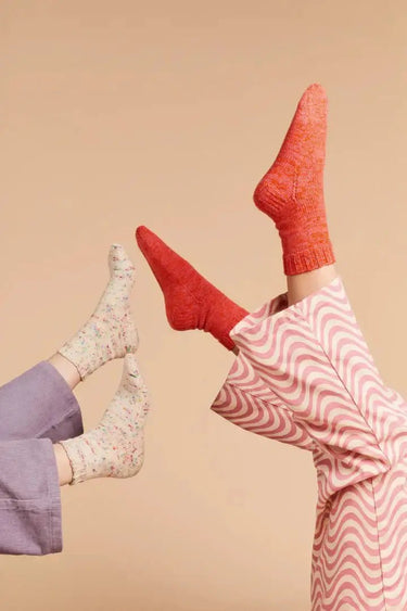 Colorful socks featured in 'Ready Steady Sock | Knitting Book', perfect for both beginners and advanced knitters.