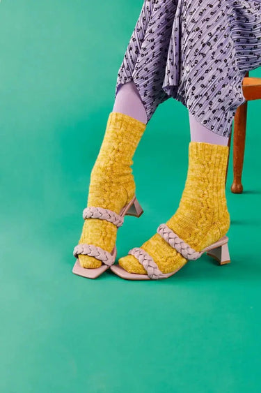 Colorful knitted socks with sandals featured in Knitting Book.