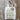 Marie Wallin tote bag with knit festive stockings design, showcasing colorful patterns on a rustic wooden floor.
