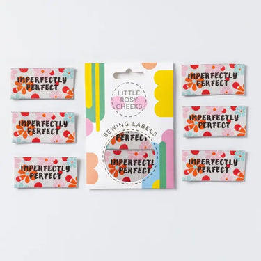 Collection of ' Imperfectly Perfect' sewing labels with colorful designs on a white background.