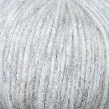 Snefnug yarn in soft light grey, featuring a luxurious blend of baby alpaca, merino wool, and organic cotton by CaMaRose.