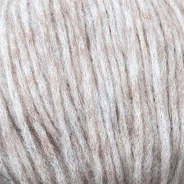 Snefnug yarn by CaMaRose, featuring a soft blend of baby alpaca, extra fine merino wool, and organic cotton in a natural beige color.