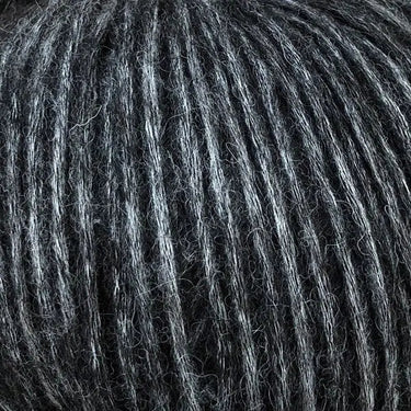 Snefnug yarn by CaMaRose in dark gray color, showcasing its soft texture made of baby alpaca, merino wool, and organic cotton blend.