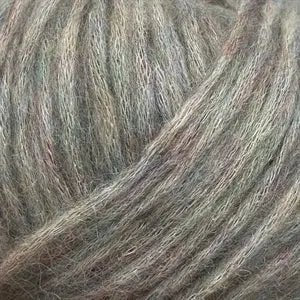 Close-up of Snefnug yarn showcasing its soft and airy texture, made from 55% baby alpaca, 10% merino wool, and 35% organic cotton.