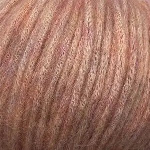 Snefnug yarn blend with baby alpaca, merino wool, and organic cotton, showcasing super soft and airy texture.