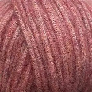 Close-up of Snefnug yarn by CaMaRose, showcasing its soft and airy texture with a blend of baby alpaca, merino wool, and organic cotton.