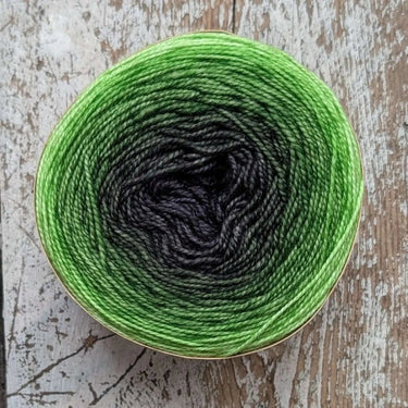 SNEK by Bilum hand-dyed merino wool in green gradient, sport and fingering weight yarn, ideal for knitting with continuous color change.