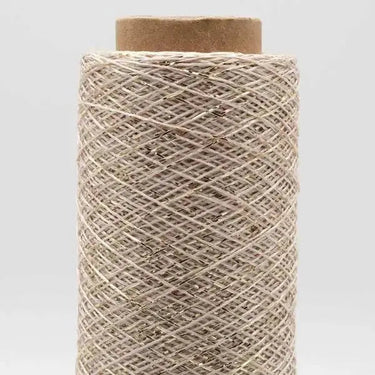 Stellaris by Kremke Soul Wool metallic yarn spool, ideal for adding shimmer to knit and crochet projects.