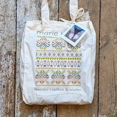 Sycamore Armwarmers Kit by Marie Wallin in tote bag on wooden floor