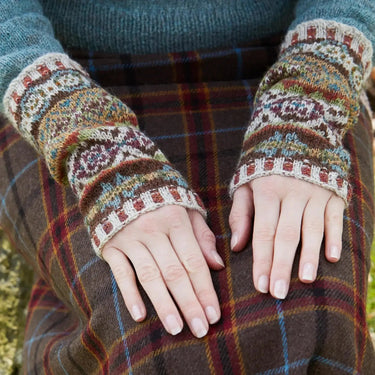 Sycamore Armwarmers Kit by Marie Wallin in colorful patterned yarn displayed on lap