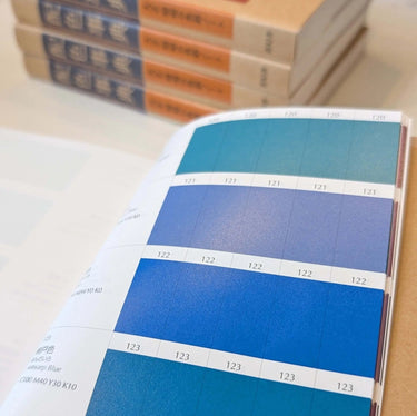 Open page of The Japanese Dictionary of Colour Combinations by Sanzo Wada showing various blue color swatches.