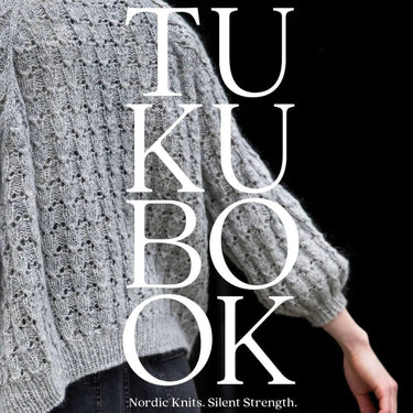 Book cover of 'TUK BOOK' featuring a knitted sweater with text 'Nordic Knits. Silent Strength.' Tukubook knitting book