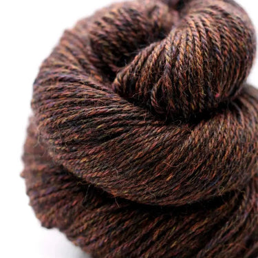 Brown skein of yarn on a white background
