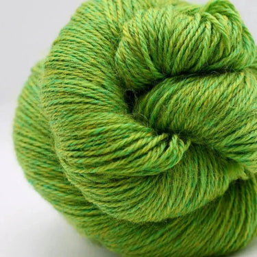 Green skein of yarn on a white background