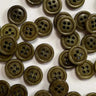 11mm Olive green stained glossy buttons, bone material, scattered on a surface.