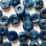 Blue buttons with a marbled pattern on a white background