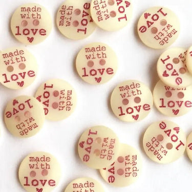 Round wooden tokens with 'made with love' text on a white background