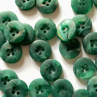 Green buttons with a marbled pattern on a white background