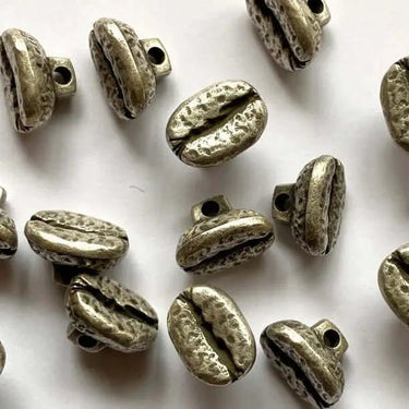 Bronze-colored beads on a white background