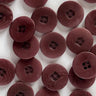 Close-up of multiple maroon buttons on a white background