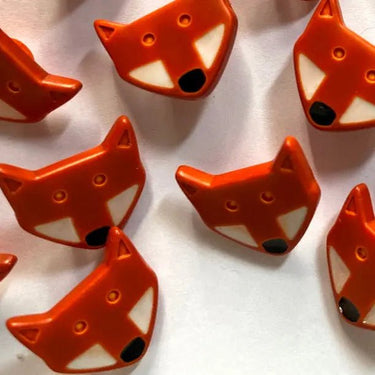 Red fox-shaped objects on a white background