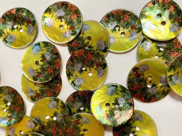 Collection of 15mm glossy shell buttons with flowers (L2) on yellow background, highlighting floral design and shell material.