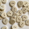 15mm rounded three sided off white cotton buttons (B2) displayed on a surface