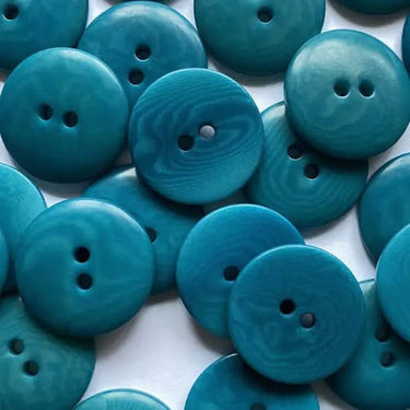 Collection of blue buttons on a white background