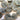 Collection of gray buttons with gold edges on a white background