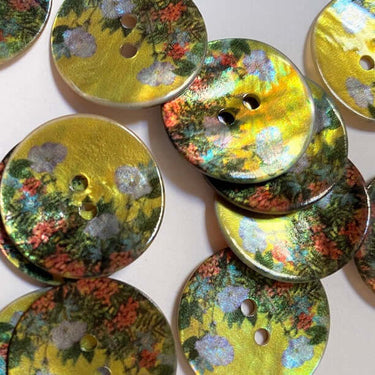 23mm Glossy Shell Buttons with Flowers (K5) on a yellow background, featuring vibrant floral design and smooth glossy finish.