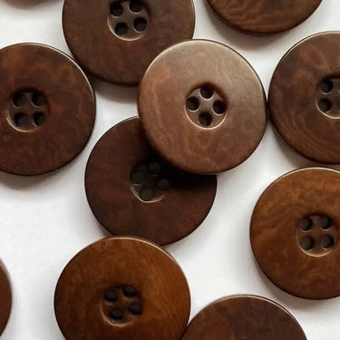 Brown buttons on a white background